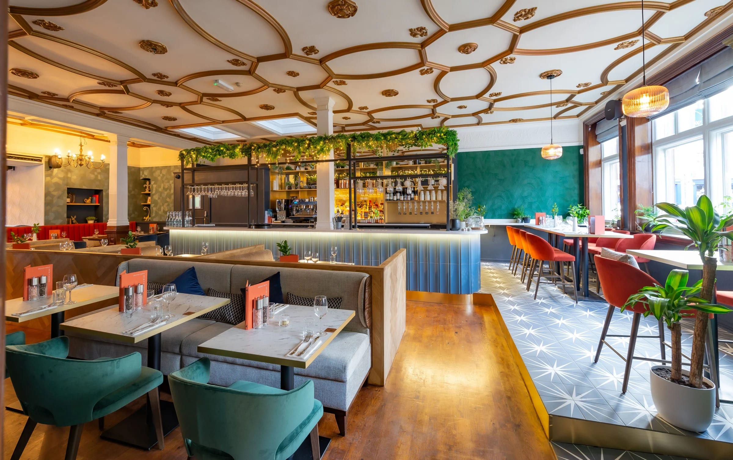 The main brasserie dining room with its gilded ceiling and teal walls